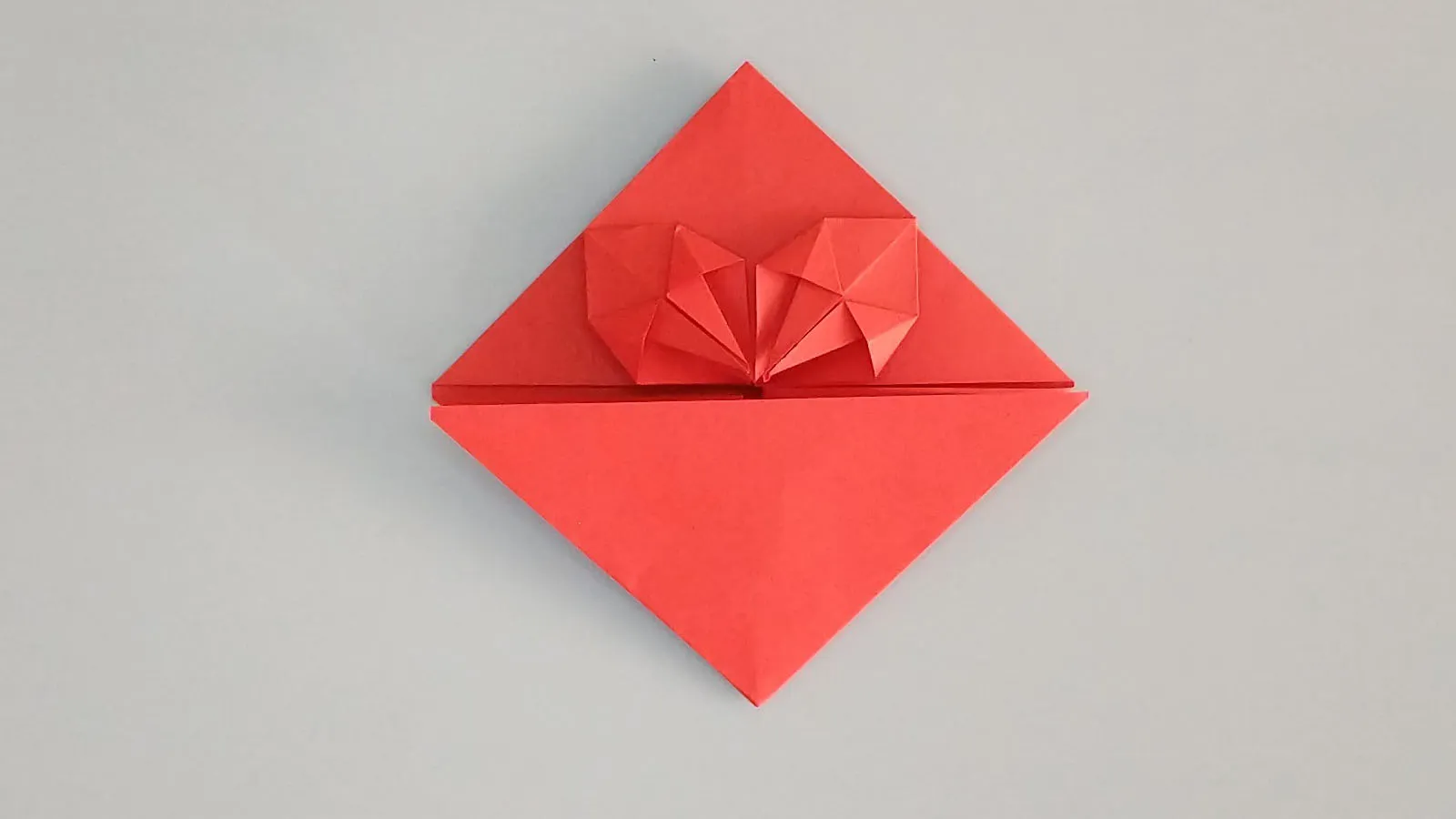 Fold origami heart from paper step 29