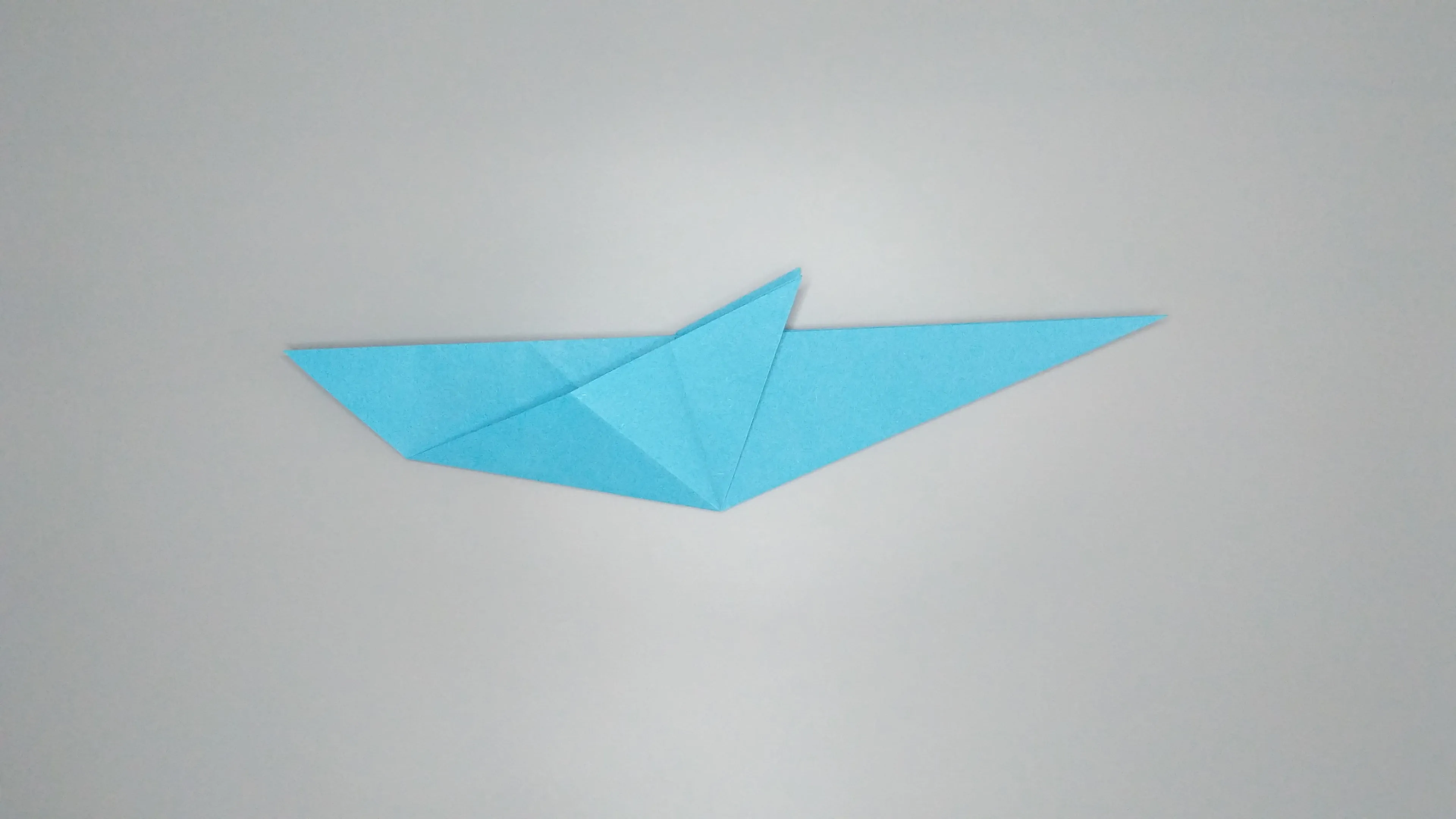 Instructions with photos for folding an origami swan. Step number 15