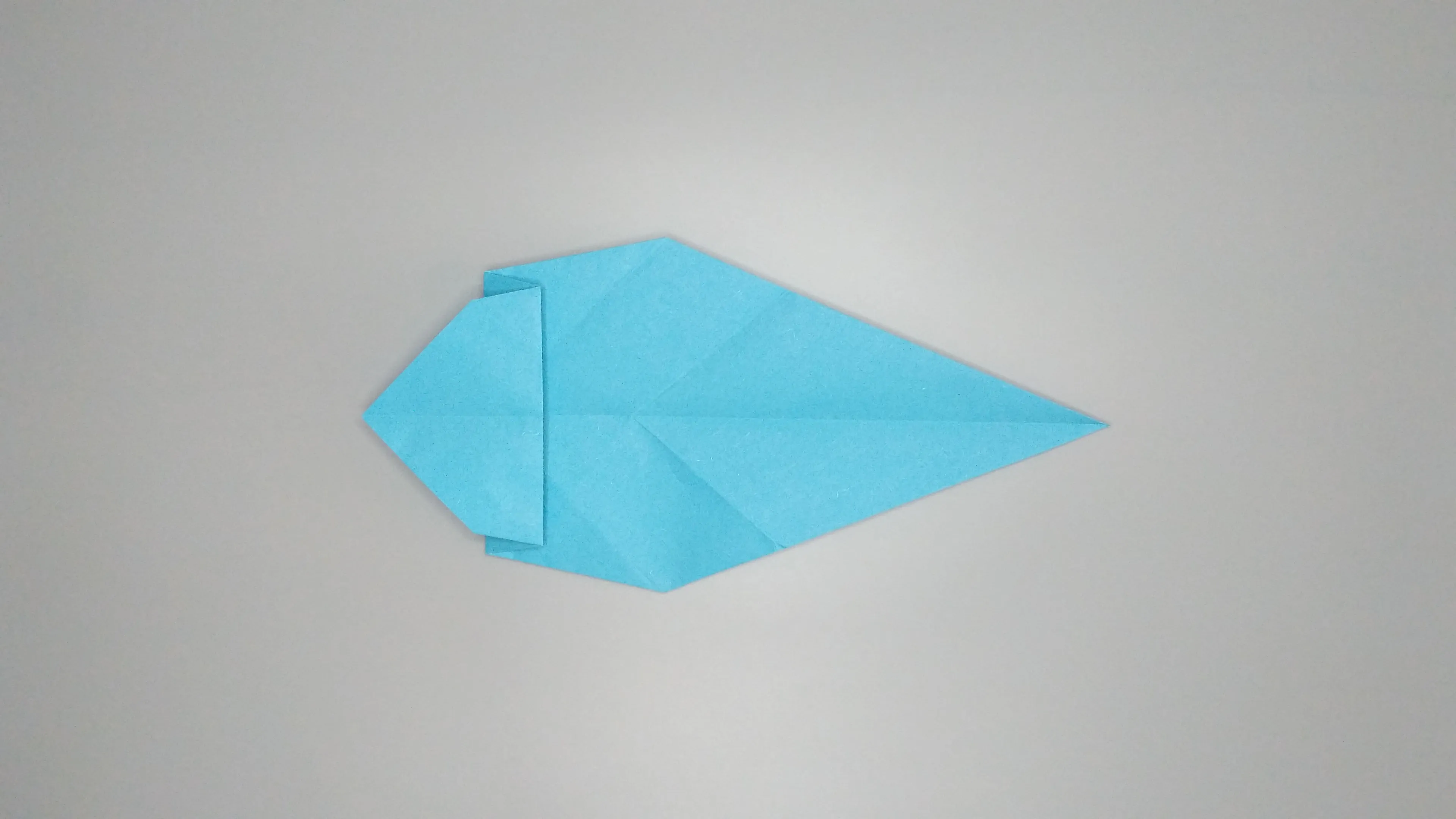 Instructions with photos for folding an origami swan. Step number 19