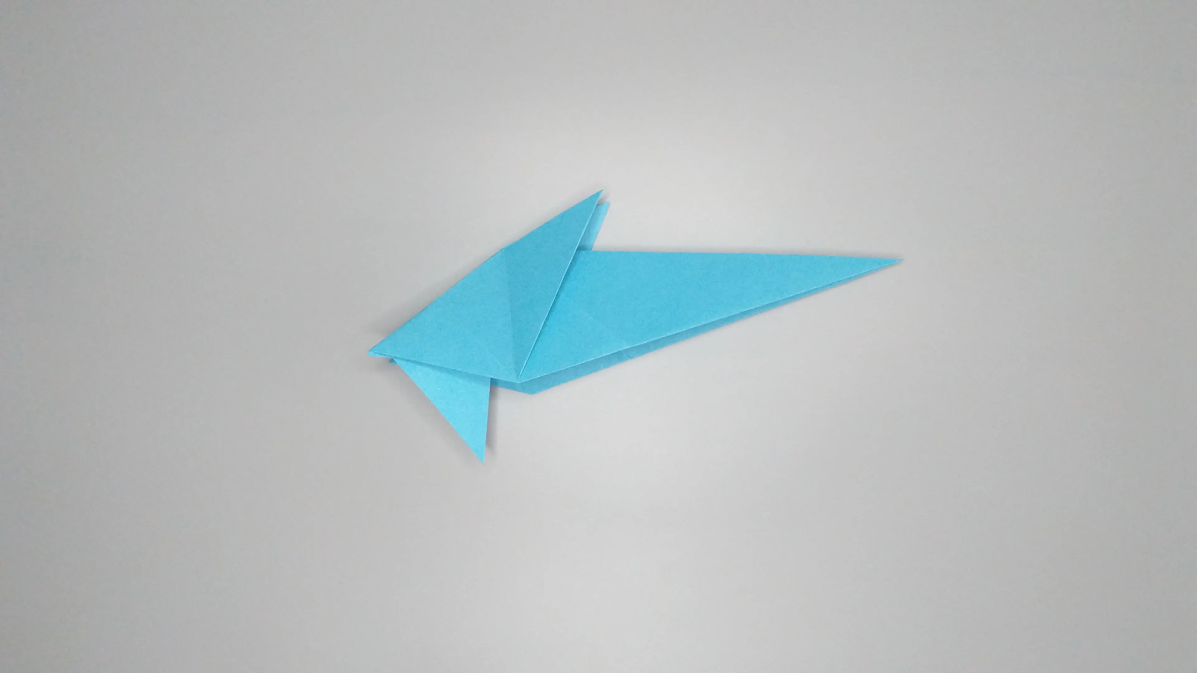 Instructions with photos for folding an origami swan. Step number 24