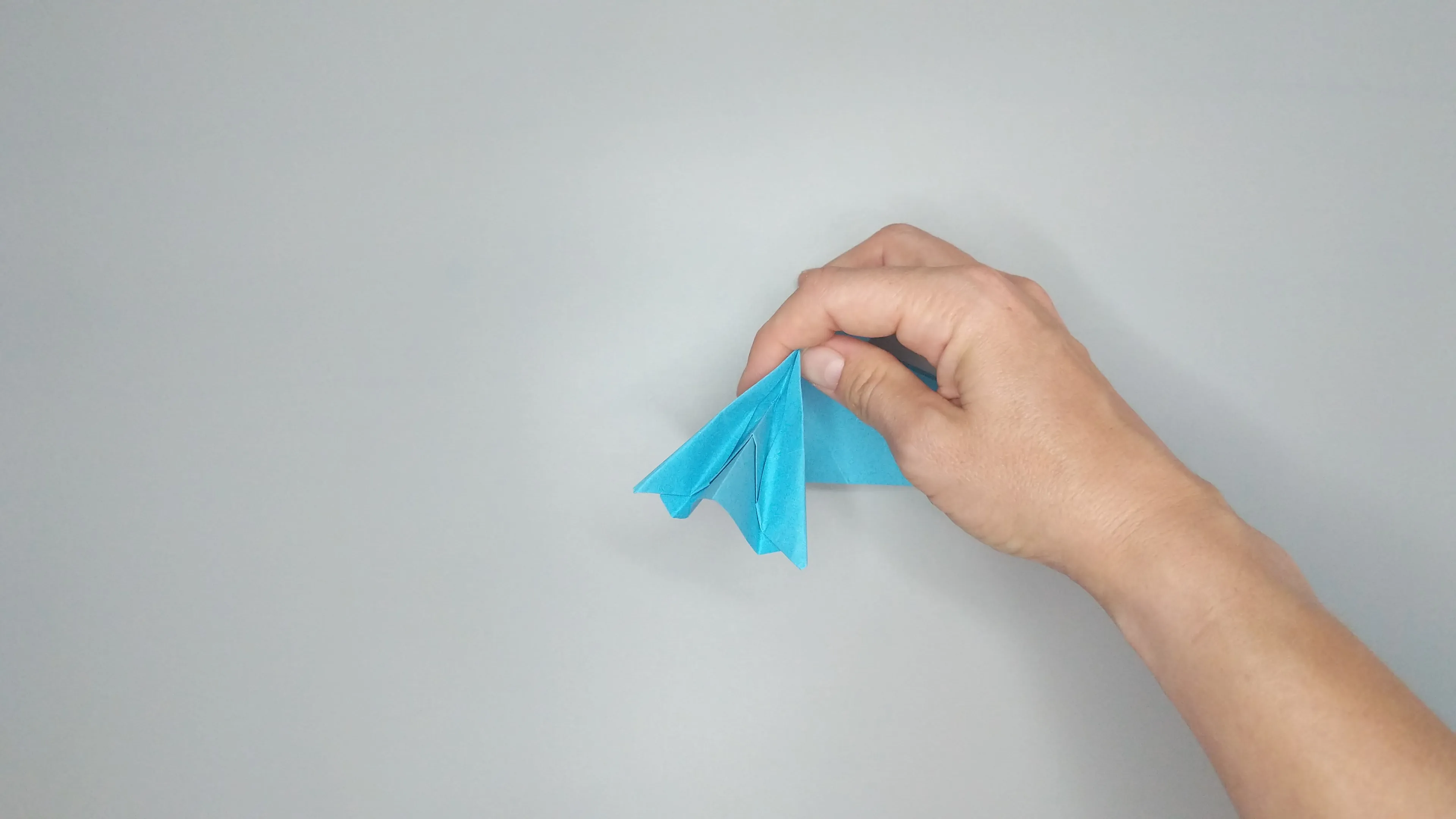 Instructions with photos for folding an origami swan. Step № 25-2