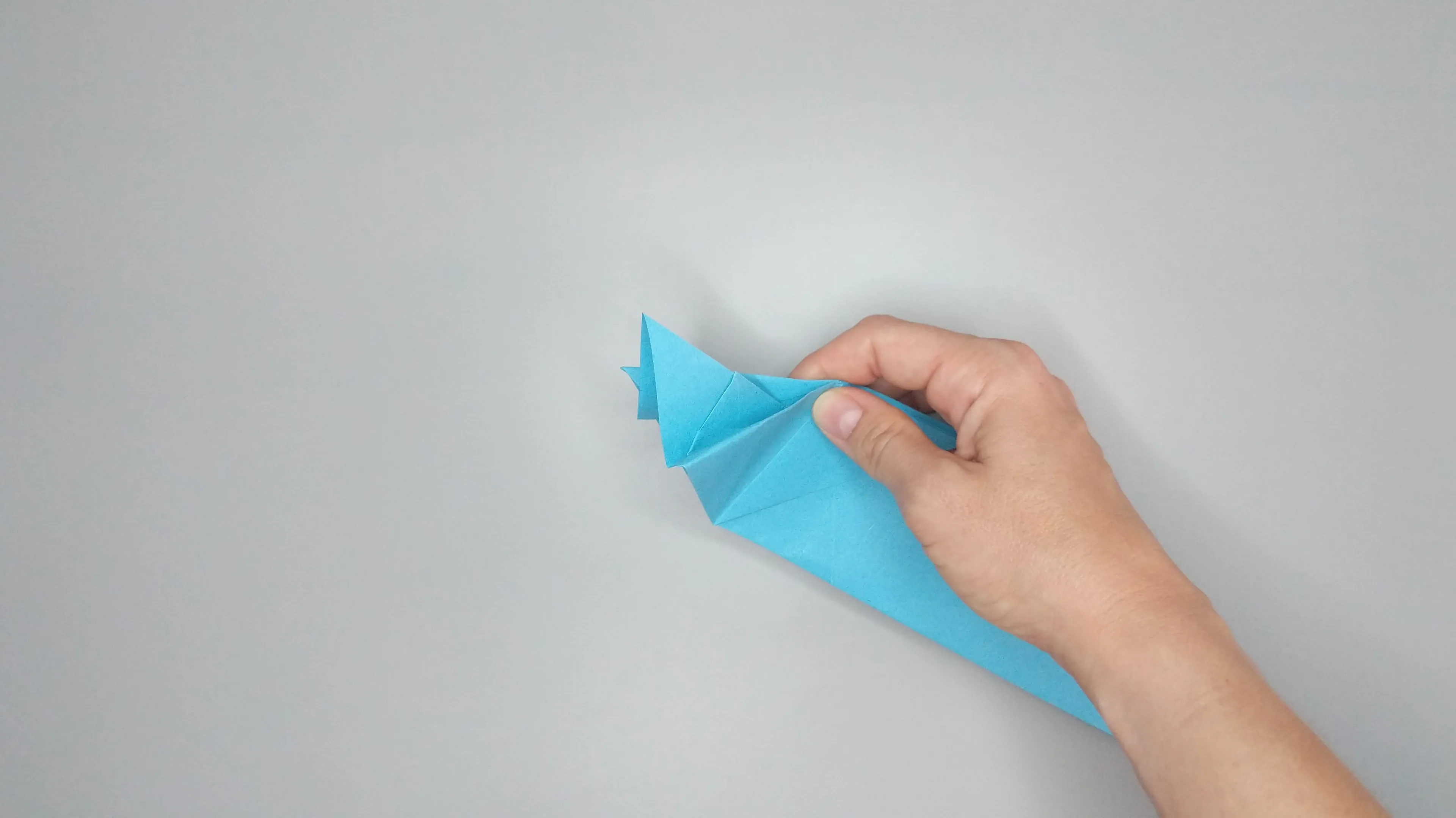 Instructions with photos for folding an origami swan. Step number 25