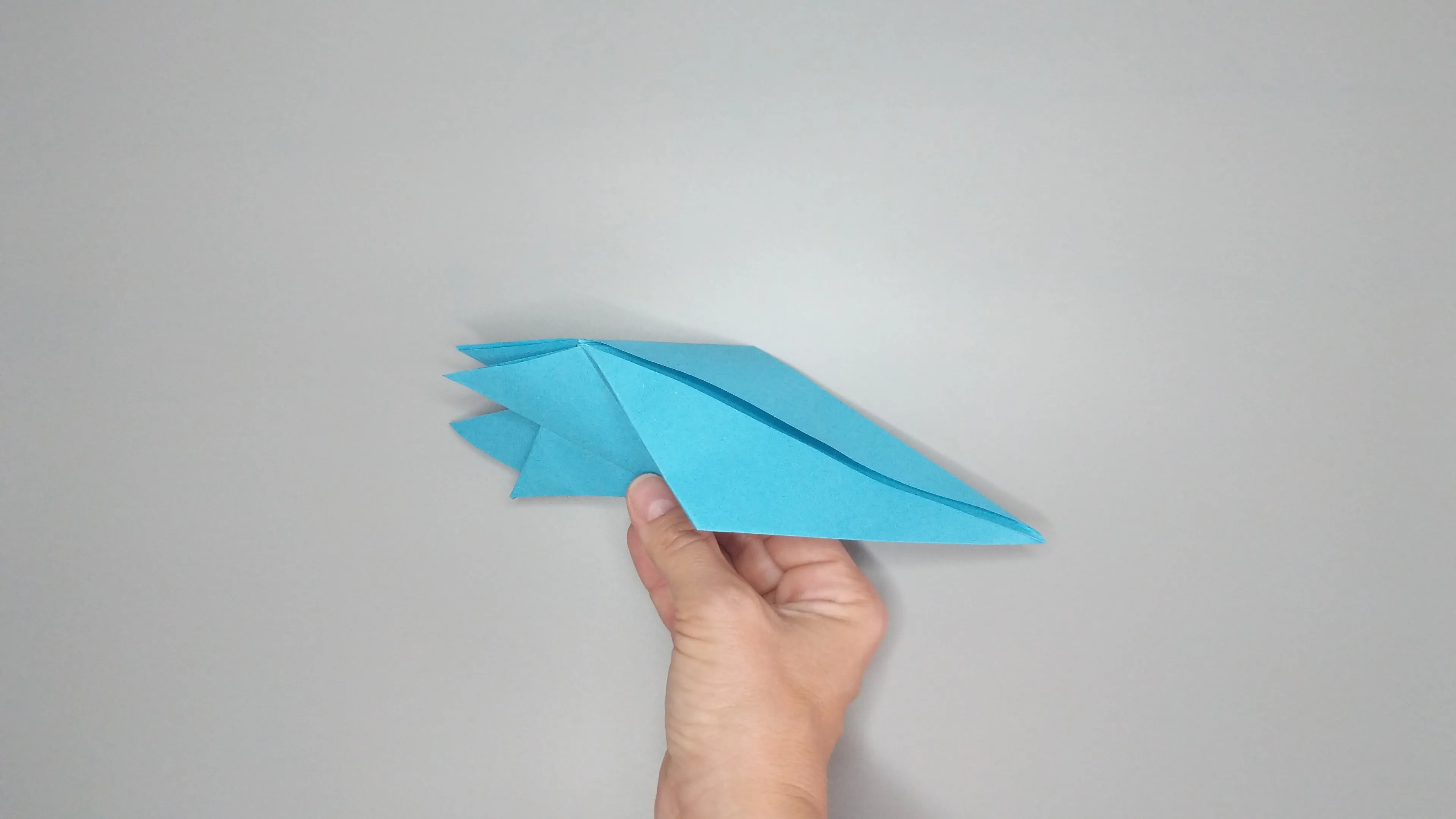 Návod s fotografiemi pro složení origami labutě. Krok číslo 27