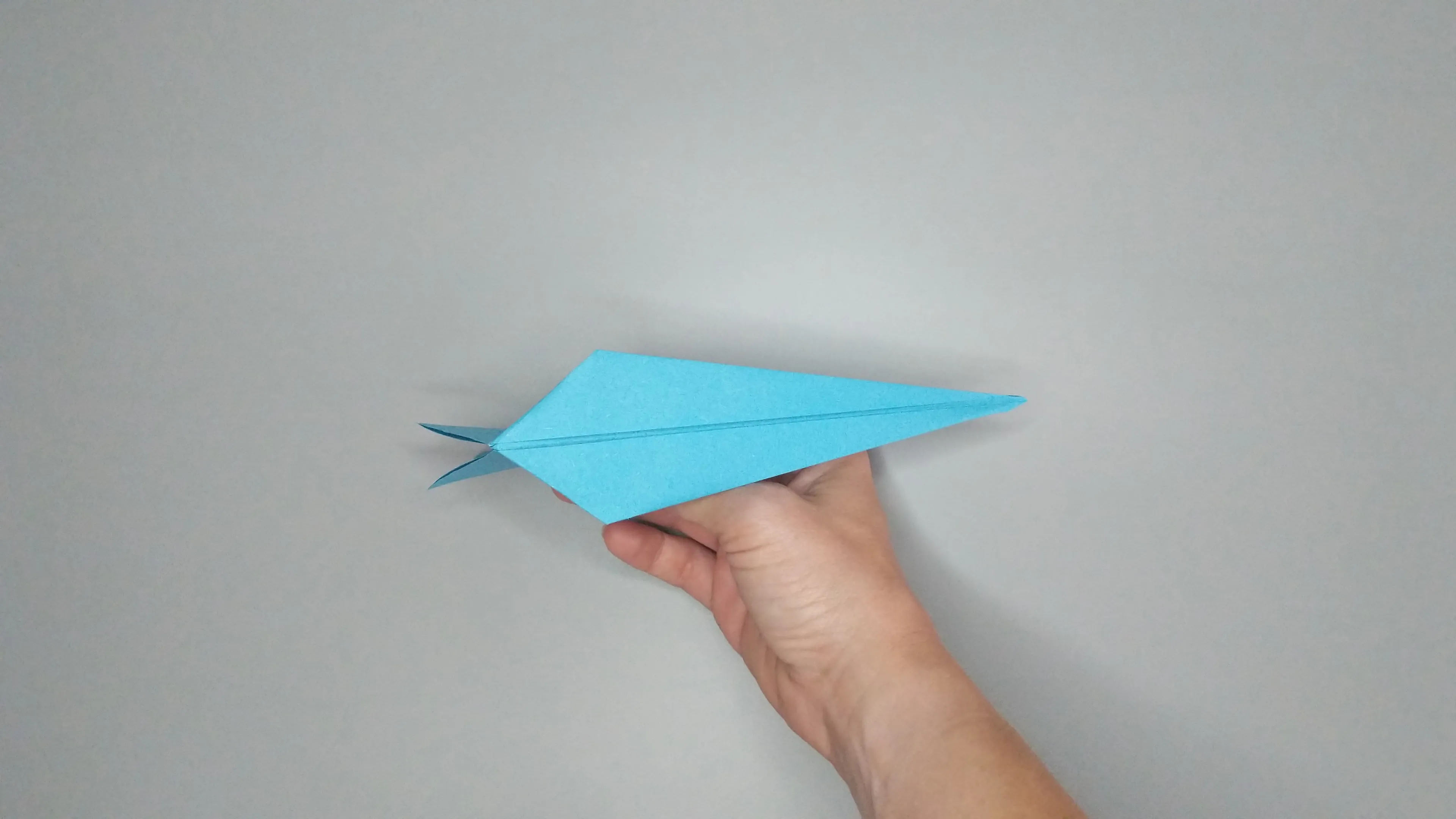 Instructions with photos for folding an origami swan. Step number 38