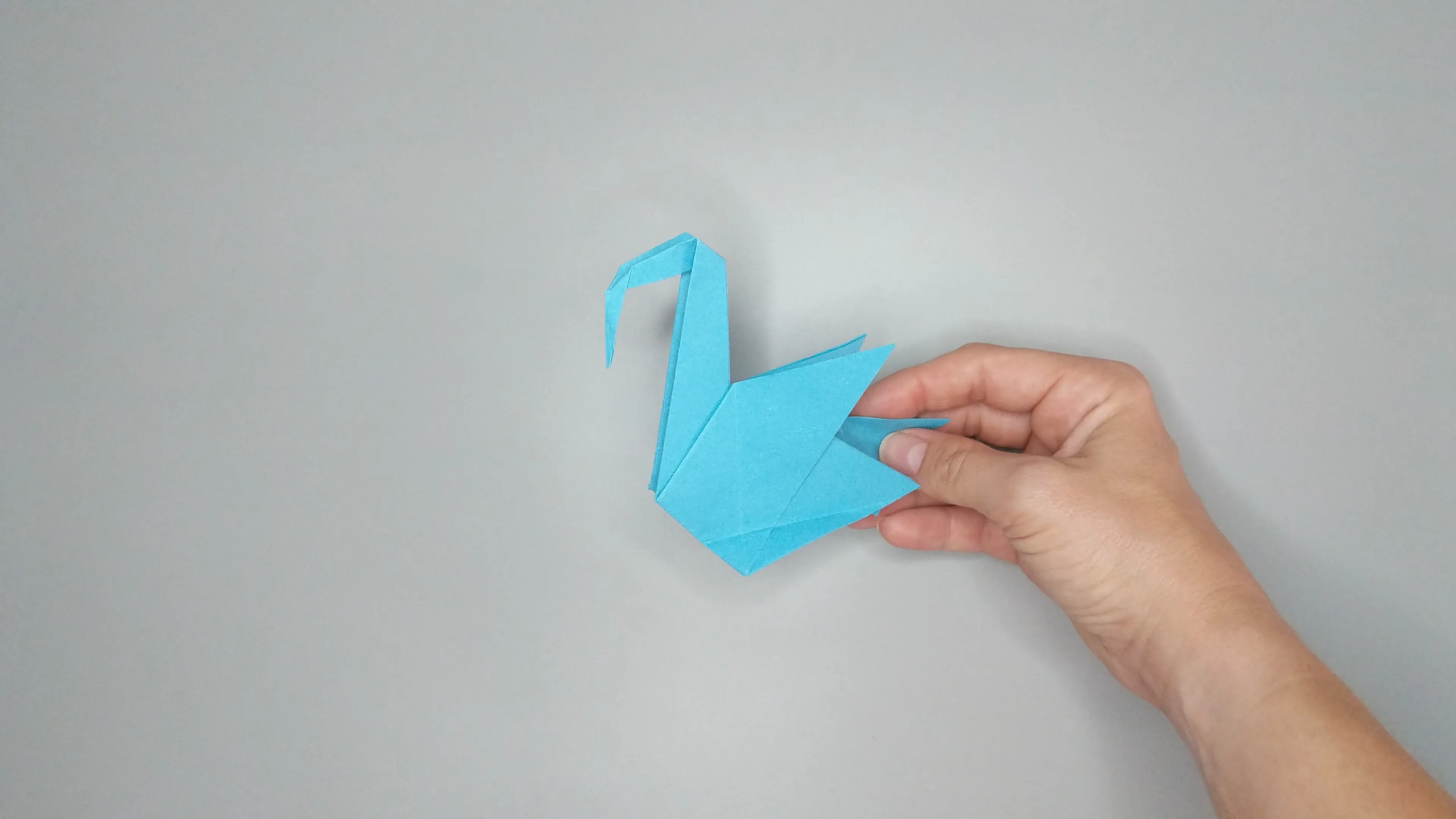 Instructions with photos for folding an origami swan. Step number 48